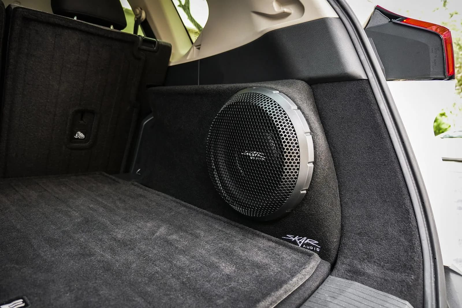 Skar Audio L-VS-1X10NISROG-2021-UP enclosure installation example — view 1